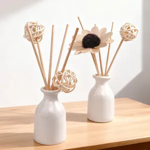 Eleganter weißer Keramik-Diffusor mit schöner Sonnenblumen- und Weidenball-Dekoration