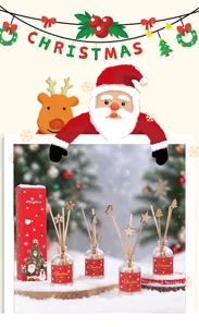 Coffret diffuseur de parfum Noël avec bâtonnets en bois et flacons festifs pour la maison.