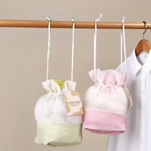 Hanging sheer organza drawstring sachet bag detail, fresh style wardrobe hanging decor.