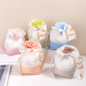 Detail view of colorful mesh rose sachet pouch with drawstring and paper tag for wardrobe aroma.