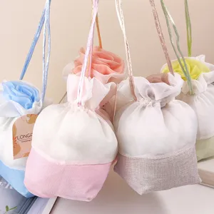 Close-up detail of hanging rose mesh sachet bags, beautiful floral fragrance decor.