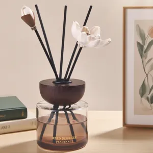 Elegant 120ml reed diffuser with lotus flower decor, perfect for home aromatherapy.