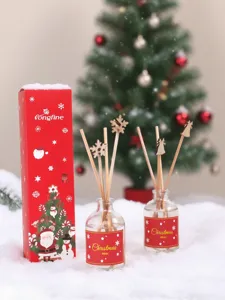 Coffret de bâtonnets parfumés de Noël avec boîte cadeau rouge et bâtons en bois décorés.