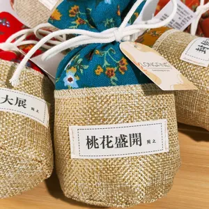 Detailed view of Chinese ancient style idiom sachet, burlap floral scented bag for wardrobe.