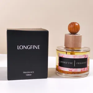 Wooden ball reed diffuser detail showing glass bottle, natural wood cap and fragrant oil.