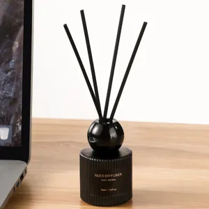 Minimalist black reed diffuser bottle with 4 sticks, 50ml fragrance for home bedroom decor.