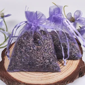 Lavender sachet detail showing purple organza mesh bag filled with dried flower grains.