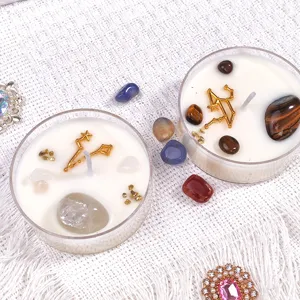 Handmade crystal scented soy wax candles with natural gemstones and constellation charms for gifts.