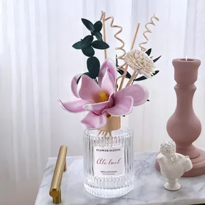 Reed diffuser set with pink flower and glass bottle for home decoration and room fragrance