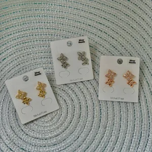 Elegant clover flower stud earrings set with sparkling zircon in gold, silver and rose gold