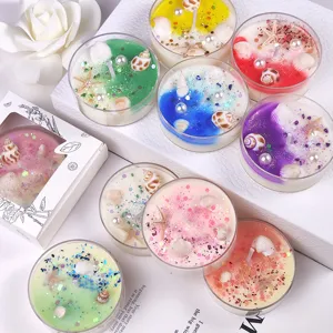 Handmade scented tealight candles with natural seashells and glitter in clear cups gift set.