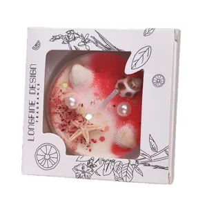 Handmade ocean style scented candle with seashells and pearls in a window gift box.