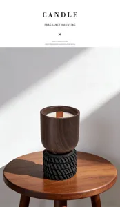Close-up of walnut wood scented candle with soy wax and unique tyre base on table.