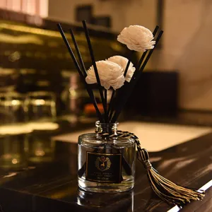 Flameless reed diffuser essential oil set with white flower sticks for home room decor.
