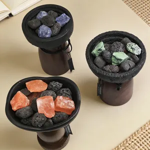 Volcanic stone aroma diffuser set with colorful crystal stones and wooden base for home decor.