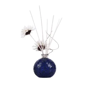 Blue mosaic glass reed diffuser bottle with aroma flowers and sticks for home fragrance decor.