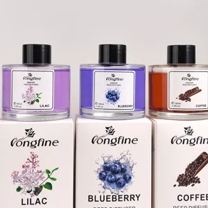 Detail shot of 130ml reed diffuser glass bottles featuring Lilac, Blueberry, and Coffee scents.