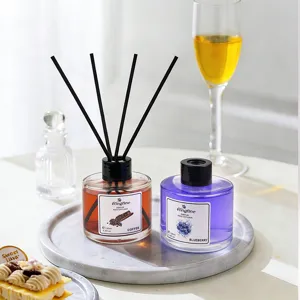 Flameless reed diffuser set, coffee and blueberry fragrance bottles with black sticks.