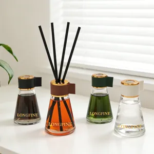 Home fragrance reed diffuser set with elegant glass bottles and sticks for aromatherapy.