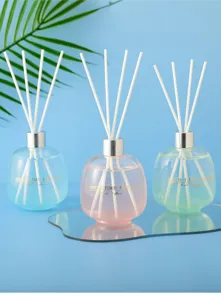 Detailed view of luxury reed diffuser set with glass bottle and white sticks for home decor.