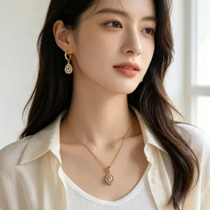 Elegante set di gioielli con collana e orecchini a goccia in acciaio inossidabile dorato