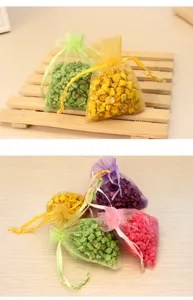 Colorful organza sachet bags filled with scented aroma stones for home and car deodorizing refresh.