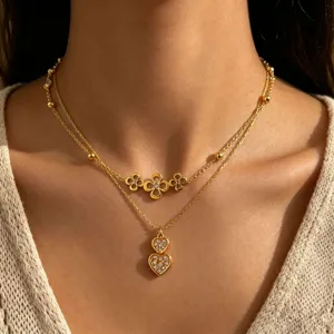 Elegant gold stainless steel layered necklace with floral clover and double heart pendants