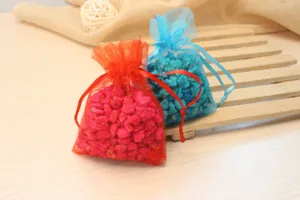 Colorful organza sachet bags filled with scented aroma stones for home and car fragrance.