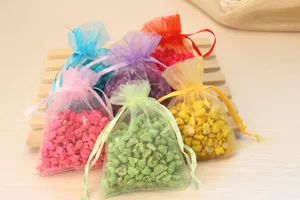 Colorful organza sachets filled with fragrant aroma stones, perfect for wardrobe, car, and home freshness.