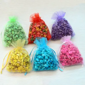 Colorful organza sachet bags filled with aromatic stones for car and home odor removal.