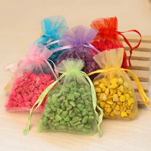 Colorful organza sachet bags filled with fragrant aroma stones for car and home deodorizer.