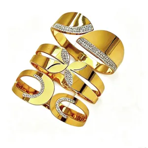 Bracciali rigidi larghi in acciaio inossidabile dorato con pavé di strass per donna
