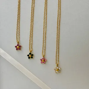 Elegant 18k gold plated titanium steel five-petal flower necklaces in multiple colors.