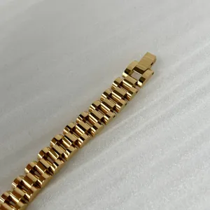 Detail view of a 10mm 18k gold plated titanium steel watch band style bracelet.