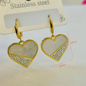 Detail view of heart-shaped stainless steel earrings with pavé rhinestones, size 20mm