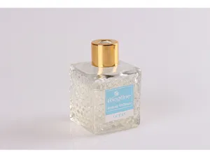 80ml glass square rattan diffuser bottle with gold cap and blue label for home fragrance.