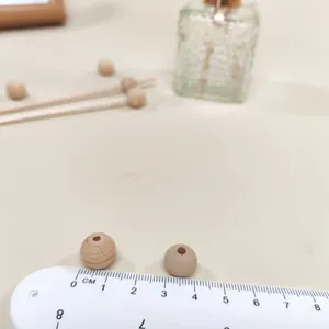 Wooden diffuser beads detail shot showing size with ruler for aromatherapy accessories.