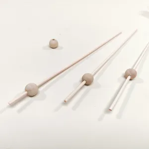 Natural wood diffuser sticks and beads set, perfect accessory for essential oil diffusion.