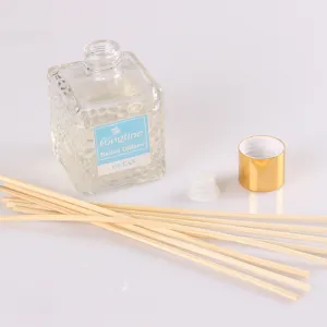 Glass rattan diffuser bottle set with natural reed sticks and ocean fragrance for home decor.
