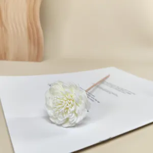 Close-up of a white PE foam flower on a wooden reed for aromatherapy diffusers