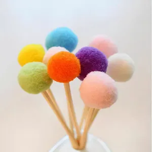 Close-up of vibrant colorful PE pom-pom diffuser sticks for home fragrance aromatherapy decor.
