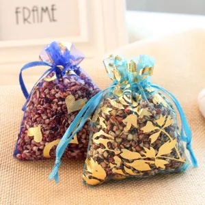 Mesh sachet bags filled with natural grains and gold foil prints for wardrobe and shoes.