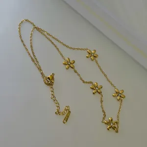 Elegant gold stainless steel daisy necklace with sparkling crystal centers for women