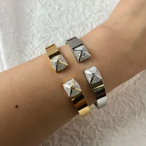 Elegant stainless steel cuff bracelets with sparkling pyramid stone studs in gold and silver.