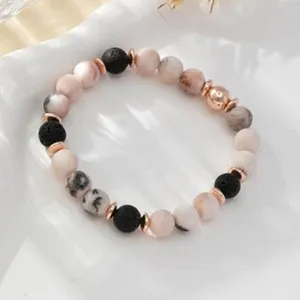 Elegant beaded bracelet featuring natural stone, lava and rose gold beads for daily wear.