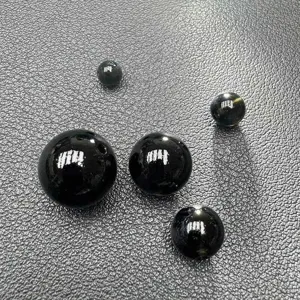 Black obsidian loose beads detail shot, smooth polished round stone for DIY jewelry making