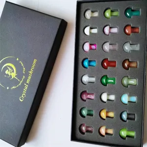 Detailed view of natural crystal mini mushroom figurines set in a black gift box packaging.