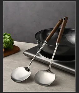Stainless steel cooking spatula with walnut wood handle, long handle kitchen utensil tool.