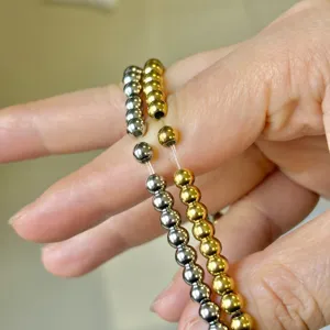 Elegant set of 18k gold plated and silver stainless steel beaded elastic bracelets
