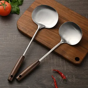 Stainless steel wok spatula with walnut handle, durable kitchen cooking spoon main view.